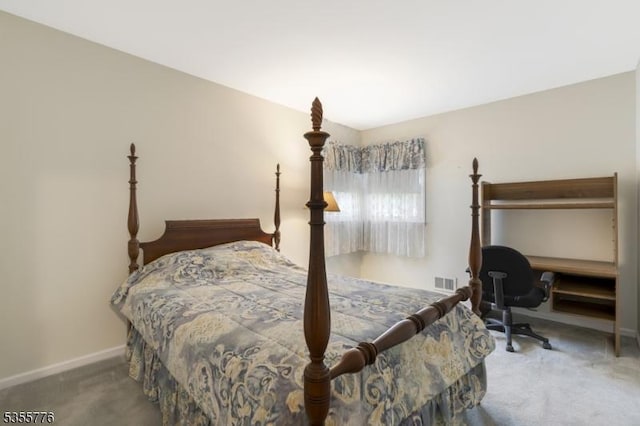 carpeted bedroom featuring baseboards