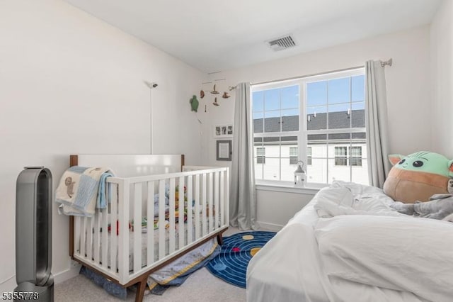bedroom featuring carpet, baseboards, and visible vents