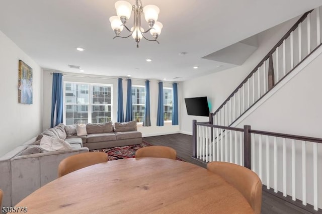 dining room featuring recessed lighting, visible vents, wood finished floors, and a notable chandelier