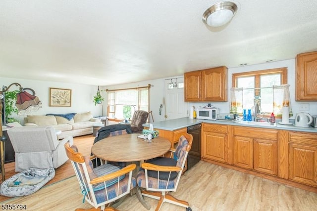 14 Sioux Trl, Wantage Twp, NJ 07461 - kitchen featuring a sink, black dishwasher, white microwave, and light wood-type flooring