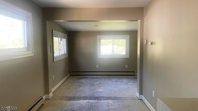 315 Tulsa Trl, Hopatcong Boro, NJ 07843 - spare room featuring baseboard heating, a baseboard heating unit, baseboards, and unfinished concrete flooring