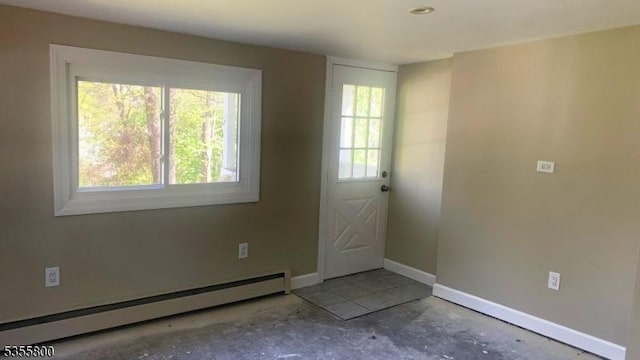 315 Tulsa Trl, Hopatcong Boro, NJ 07843 - foyer entrance featuring a baseboard radiator, concrete flooring, baseboards, and healthy amount of natural light
