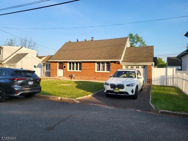 68 Echo Pl, Elmwood Park Boro, NJ 07407 - view of front facade featuring brick siding, driveway, a shingled roof, a chimney, and an attached garage