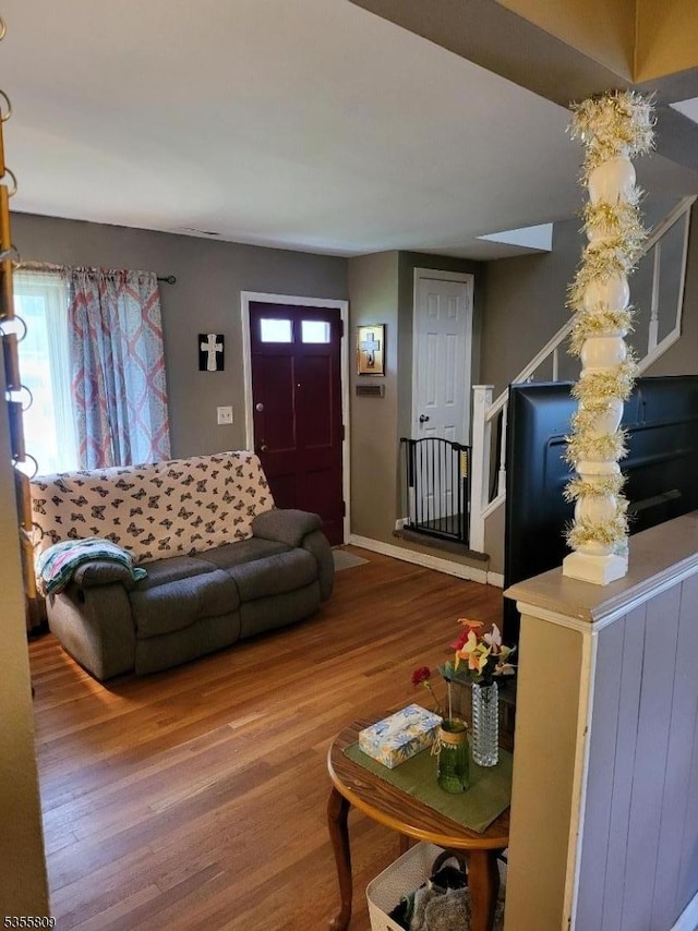 68 Echo Pl, Elmwood Park Boro, NJ 07407 - living area with wood finished floors, plenty of natural light, stairway, and baseboards