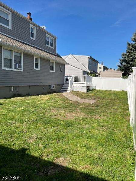 68 Echo Pl, Elmwood Park Boro, NJ 07407 - rear view of property featuring a wooden deck
