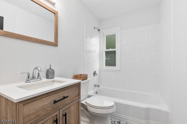 full bath featuring toilet, washtub / shower combination, and vanity