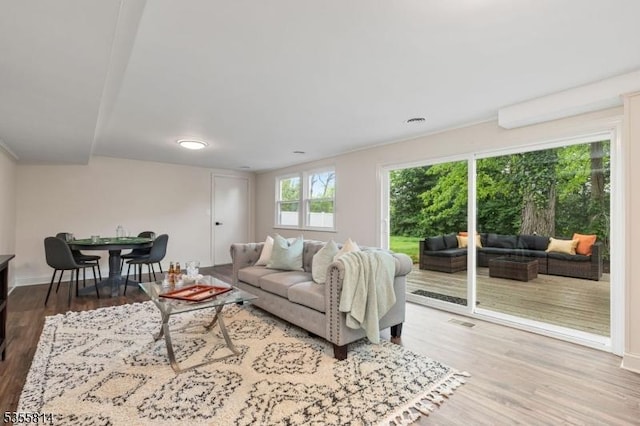 living room with wood finished floors and baseboards