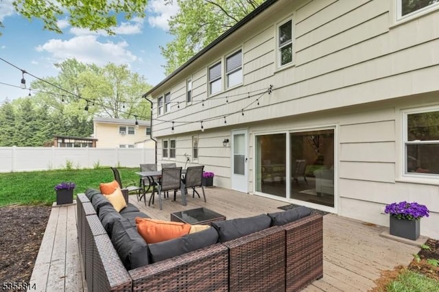 deck with an outdoor hangout area and outdoor dining space