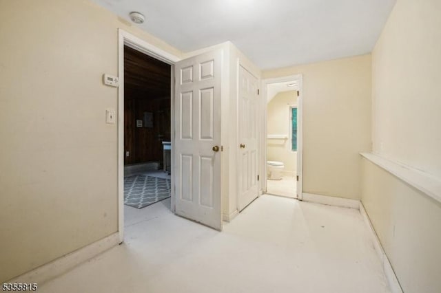 1078 Mountain Ave, Berkeley Heights Twp, NJ 07922 - unfurnished bedroom with concrete flooring, ensuite bathroom, and baseboards