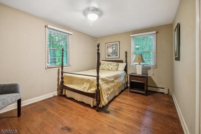 1078 Mountain Ave, Berkeley Heights Twp, NJ 07922 - bedroom with a baseboard radiator, multiple windows, wood finished floors, and baseboards
