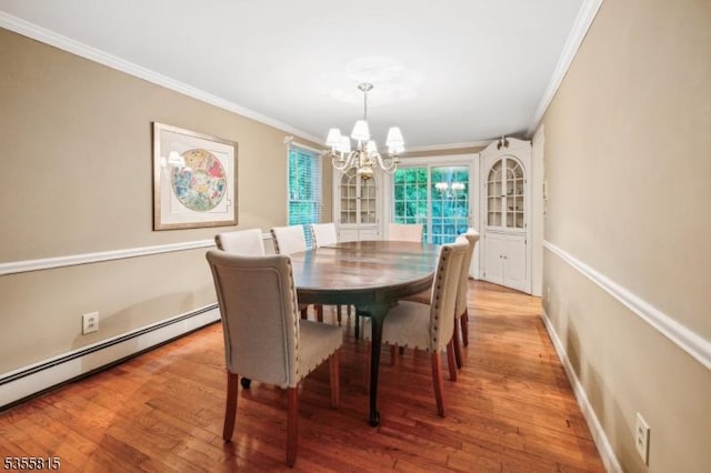 1078 Mountain Ave, Berkeley Heights Twp, NJ 07922 - dining room with crown molding, a chandelier, a baseboard heating unit, and light wood finished floors