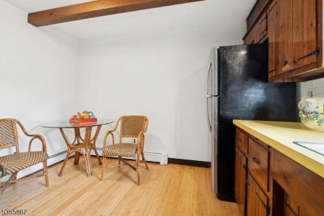 7 Fairhaven Dr, Parsippany-Troy Hills Twp, NJ 07950 - kitchen featuring light wood finished floors, light countertops, brown cabinets, beam ceiling, and freestanding refrigerator