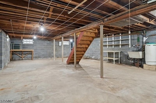 7 Fairhaven Dr, Parsippany-Troy Hills Twp, NJ 07950 - below grade area featuring stairway, water heater, and a sink