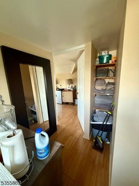 hall with wood finished floors