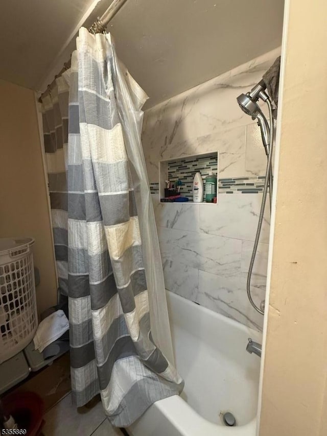 bathroom featuring shower / bath combination with curtain
