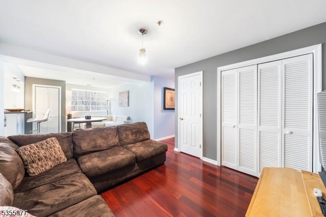 living area featuring wood finished floors and baseboards