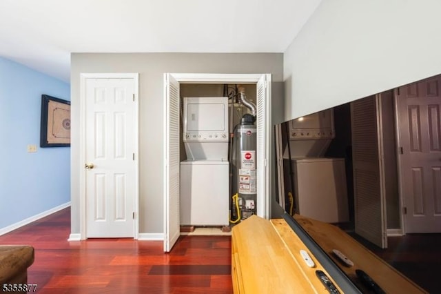 playroom featuring stacked washer / dryer, gas water heater, wood finished floors, and baseboards