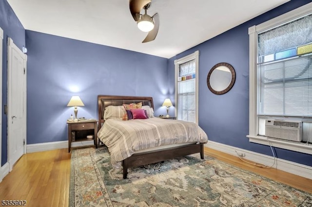 128 W High St, Somerville Boro, NJ 08876 - bedroom featuring wood finished floors, baseboards, cooling unit, and a ceiling fan