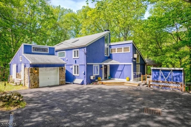 17 Summit Rd, Mendham Twp, NJ 07945 - view of front of property with driveway, roof with shingles, stone siding, and an outdoor structure