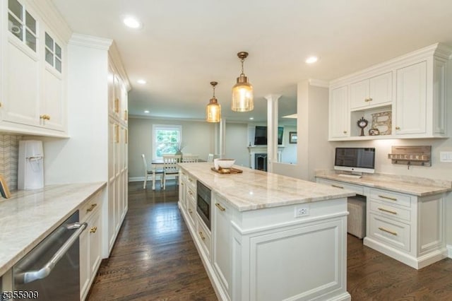 kitchen with recessed lighting, white cabinets, dark wood-style flooring, appliances with stainless steel finishes, and a kitchen island