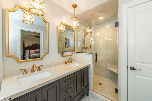 full bathroom with double vanity, marble look tiles, ensuite bath, a shower stall, and a chandelier