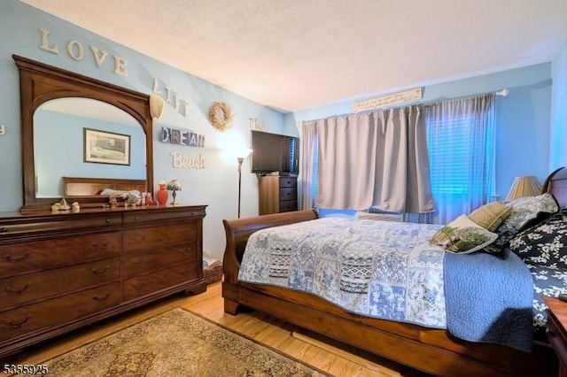 bedroom featuring wood finished floors