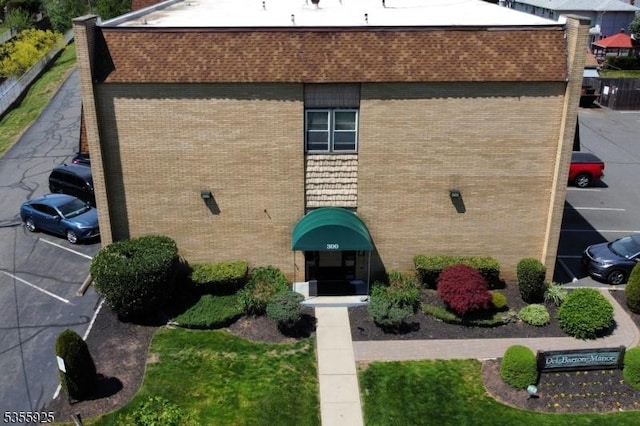 view of property with uncovered parking