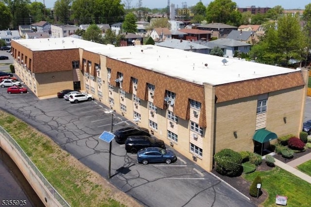 view of property with uncovered parking