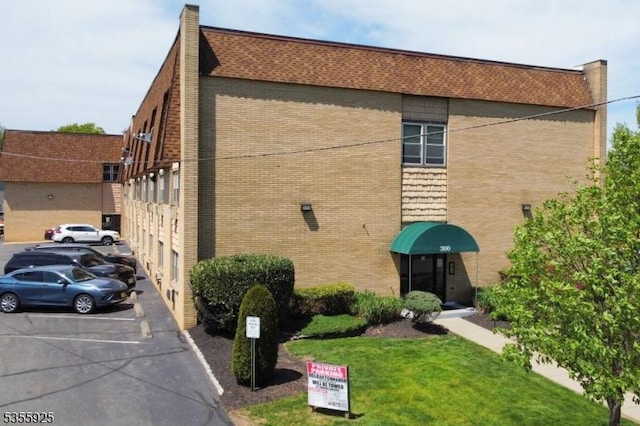 view of property with uncovered parking