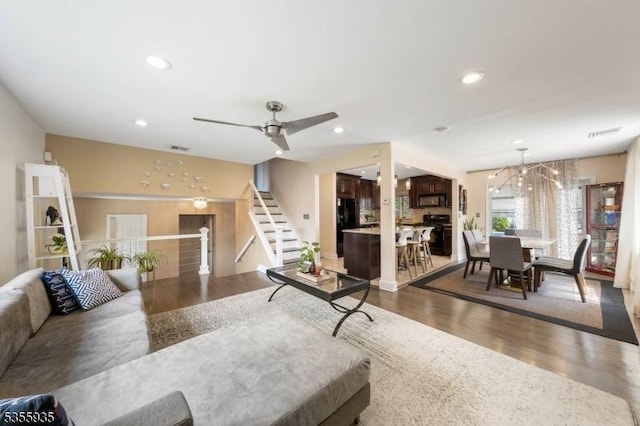 74 Emerald Pl, Clark Twp, NJ 07066 - living area with wood finished floors, recessed lighting, ceiling fan, stairs, and a chandelier