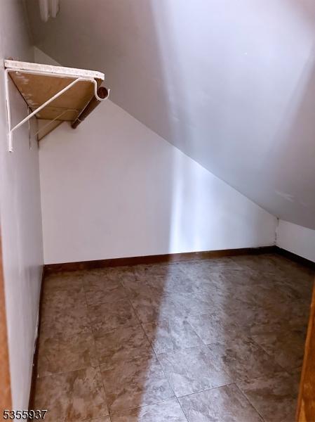 bonus room with vaulted ceiling