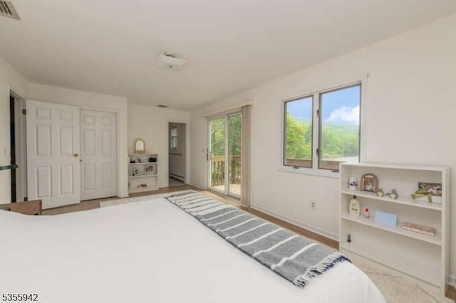 7 Capstan Rd, West Milford Twp, NJ 07480 - bedroom with access to outside, a baseboard radiator, and baseboards