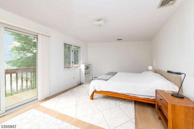 7 Capstan Rd, West Milford Twp, NJ 07480 - bedroom with access to exterior and light wood-style floors