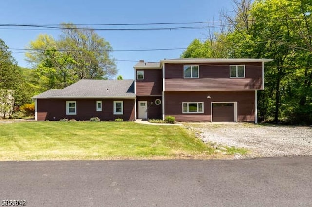 7 Capstan Rd, West Milford Twp, NJ 07480 - view of front of house with driveway, a front lawn, and a garage