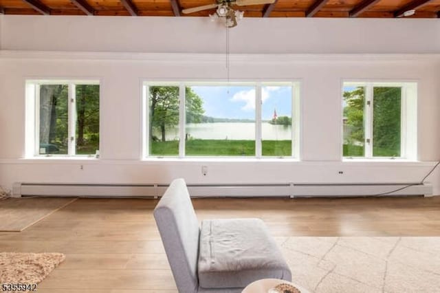 7 Capstan Rd, West Milford Twp, NJ 07480 - unfurnished living room with wooden ceiling with exposed beams, light wood-type flooring, plenty of natural light, and a water view
