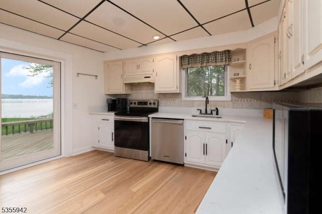 7 Capstan Rd, West Milford Twp, NJ 07480 - kitchen with appliances with stainless steel finishes, a sink, light countertops, healthy amount of natural light, and a paneled ceiling
