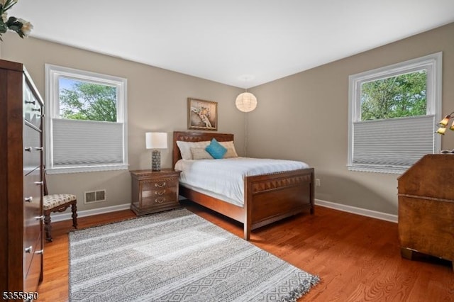 53 Woodland Ave, Morris Twp, NJ 07960 - bedroom featuring multiple windows, baseboards, and wood finished floors