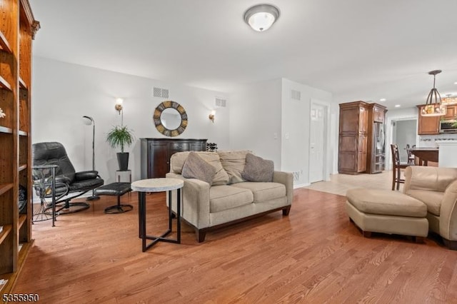 53 Woodland Ave, Morris Twp, NJ 07960 - living room with light wood-style flooring, a fireplace, and recessed lighting