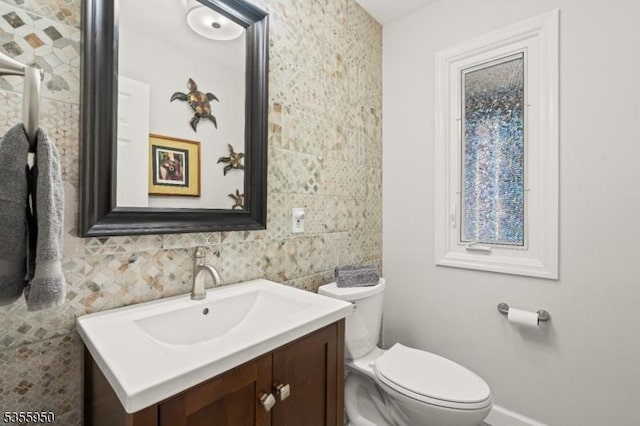 53 Woodland Ave, Morris Twp, NJ 07960 - half bath featuring toilet, vanity, baseboards, and tile walls