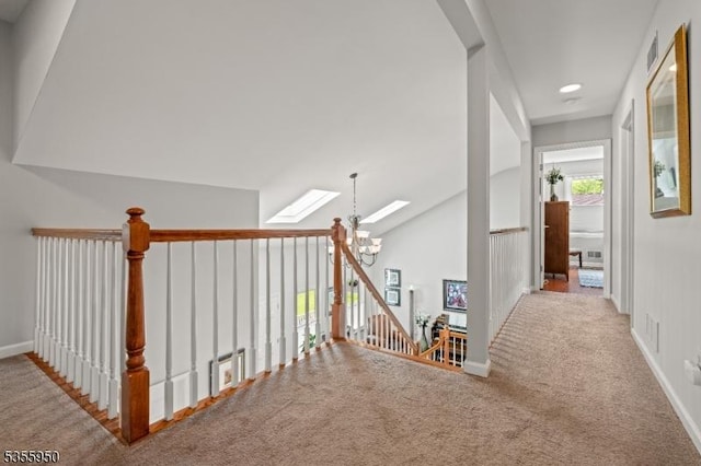 53 Woodland Ave, Morris Twp, NJ 07960 - hall with a skylight, carpet, baseboards, vaulted ceiling, and an upstairs landing