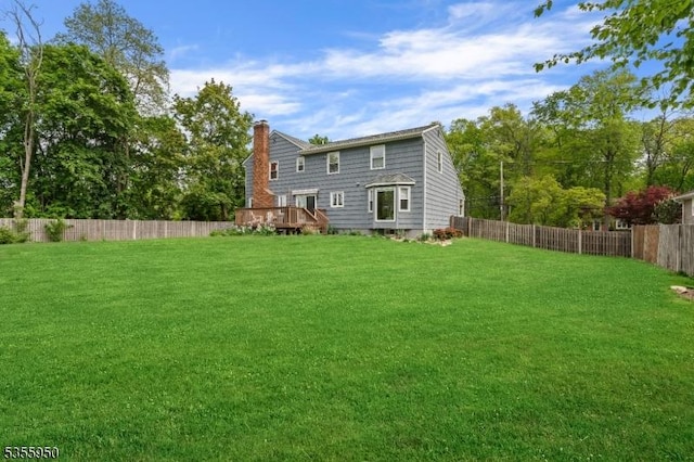 53 Woodland Ave, Morris Twp, NJ 07960 - back of house featuring a chimney and a wooden deck