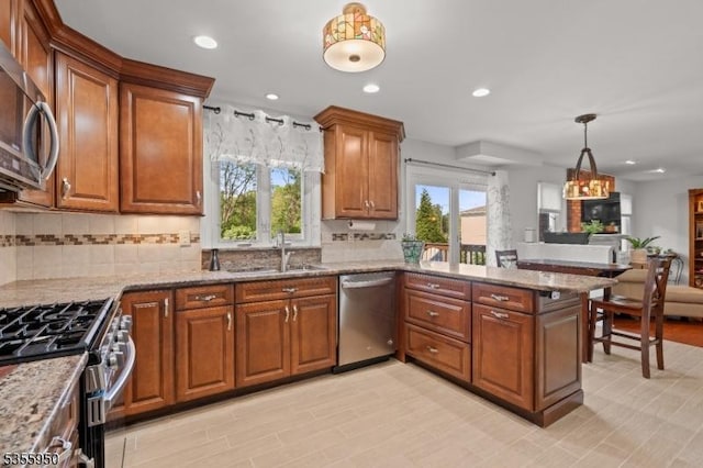 53 Woodland Ave, Morris Twp, NJ 07960 - kitchen featuring appliances with stainless steel finishes, a sink, healthy amount of natural light, a peninsula, and recessed lighting