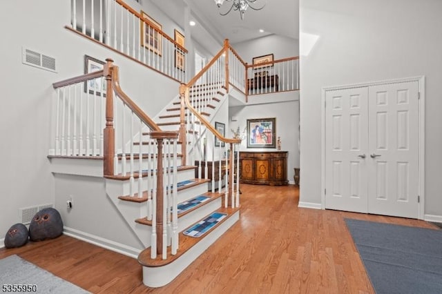53 Woodland Ave, Morris Twp, NJ 07960 - stairs with a high ceiling, wood finished floors, a chandelier, baseboards, and recessed lighting