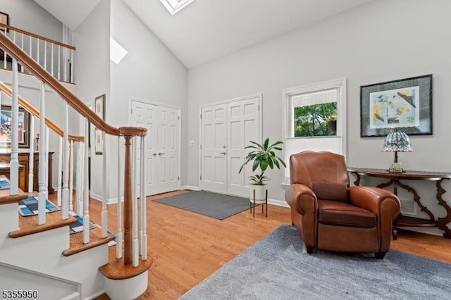 53 Woodland Ave, Morris Twp, NJ 07960 - entryway featuring stairway, wood finished floors, high vaulted ceiling, and baseboards