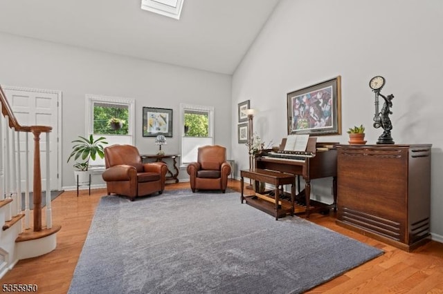 53 Woodland Ave, Morris Twp, NJ 07960 - sitting room featuring stairway, light wood-style flooring, high vaulted ceiling, and baseboards