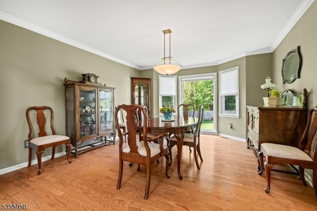 53 Woodland Ave, Morris Twp, NJ 07960 - dining space with baseboards, light wood-style floors, and ornamental molding