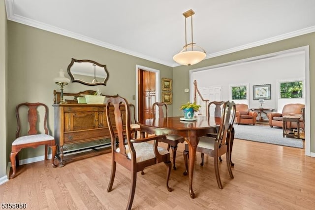 53 Woodland Ave, Morris Twp, NJ 07960 - dining space featuring ornamental molding, light wood finished floors, and baseboards