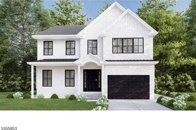 view of front of home with a garage, driveway, and a front lawn
