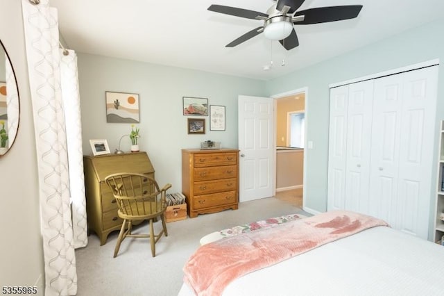 carpeted bedroom featuring a closet and a ceiling fan