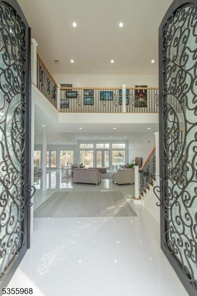 34 W Shore Rd, Mountain Lakes Boro, NJ 07046 - entryway with a towering ceiling, stairway, and recessed lighting